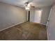 An empty room with a ceiling fan and access to an ensuite and walk-in wardrobe at 5064 Park Central Dr # 1731, Orlando, FL 32839
