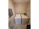 Efficient laundry room with a stacked washer and dryer, offering convenience in a compact space at 5064 Park Central Dr # 1731, Orlando, FL 32839