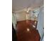 Bright living room with sleek wooden floors, ceiling fan, and an open layout to the kitchen at 5064 Park Central Dr # 1731, Orlando, FL 32839