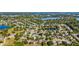 Stunning aerial view of a lush neighborhood with trees and waterways, showcasing community living at 5108 Legacy Oaks Dr, Orlando, FL 32839