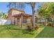 Spacious backyard featuring a pergola-covered patio, perfect for outdoor entertaining and relaxation at 5108 Legacy Oaks Dr, Orlando, FL 32839