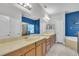 Spacious bathroom featuring double sinks, a large mirror, and separate bathtub and shower at 5108 Legacy Oaks Dr, Orlando, FL 32839