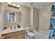 Bathroom with a bathtub and shower combination, single sink, mirror, and white toilet at 5108 Legacy Oaks Dr, Orlando, FL 32839