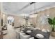 Open-concept dining and living area with modern chandelier and stylish decor at 5108 Legacy Oaks Dr, Orlando, FL 32839