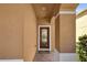 Inviting entryway featuring a decorative glass front door and a columned porch at 5108 Legacy Oaks Dr, Orlando, FL 32839