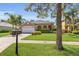Picture of house at 5108, lush lawn, and mature palm trees, offering a serene curb appeal at 5108 Legacy Oaks Dr, Orlando, FL 32839