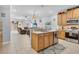 Bright, open kitchen featuring stainless steel appliances and a seamless flow into the living area at 5108 Legacy Oaks Dr, Orlando, FL 32839
