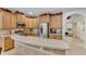 Modern kitchen boasts stainless steel appliances, granite countertops, and ample cabinet space at 5108 Legacy Oaks Dr, Orlando, FL 32839