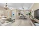 Inviting living and dining space with neutral tones, chandelier, and ample natural light at 5108 Legacy Oaks Dr, Orlando, FL 32839