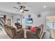 Living room features plush furniture, and a mounted television at 5108 Legacy Oaks Dr, Orlando, FL 32839