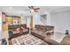 An open floor plan with a spacious living room, leading to a kitchen and staircase at 5108 Legacy Oaks Dr, Orlando, FL 32839