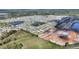 Property aerial view overlooking a serene pond; a peaceful neighborhood with new construction in sight at 5645 Camilla St, St Cloud, FL 34771