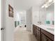 Bathroom with tile flooring, double vanity, and picture at 5645 Camilla St, St Cloud, FL 34771