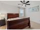 Bedroom featuring a ceiling fan, natural light, and a wooden headboard at 5645 Camilla St, St Cloud, FL 34771