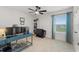 Spacious bedroom with a work desk, large window, and neutral carpeting at 5645 Camilla St, St Cloud, FL 34771