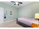 Comfortable bedroom with plush carpet, closet, and serene green walls at 5645 Camilla St, St Cloud, FL 34771
