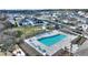 Stunning community pool featuring modern lounge seating, a covered picnic area, and lush landscaping for relaxation and leisure at 5645 Camilla St, St Cloud, FL 34771