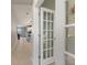 Inviting hallway with tile flooring that leads to an open-concept living space at 5645 Camilla St, St Cloud, FL 34771