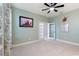 Home office with a ceiling fan, tile floors, double doors and natural light at 5645 Camilla St, St Cloud, FL 34771