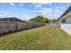 Expansive backyard with lush green grass and a privacy fence, perfect for outdoor enjoyment at 607 Dunblane Dr, Winter Park, FL 32792