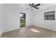 Bright bedroom showcasing sleek, modern windows that frame the landscape and sleek new flooring at 607 Dunblane Dr, Winter Park, FL 32792