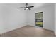 Bright bedroom with a window showing the landscape at 607 Dunblane Dr, Winter Park, FL 32792
