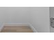 A walk-in closet featuring a clean, minimal aesthetic with modern baseboards and durable vinyl flooring at 607 Dunblane Dr, Winter Park, FL 32792