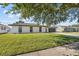 Charming single-story home featuring a well-manicured lawn, attached garage, and clean architectural lines at 607 Dunblane Dr, Winter Park, FL 32792