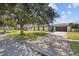 Charming single-story home with well-maintained front yard, mature tree, and attached garage at 607 Dunblane Dr, Winter Park, FL 32792