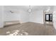 Bright living room showing steps to main entrance and steps to another room at 607 Dunblane Dr, Winter Park, FL 32792