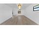 Living room boasts wood-look floors, modern lighting and a neutral color palette at 607 Dunblane Dr, Winter Park, FL 32792
