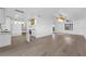 Open floor plan showing bright living room and modern kitchen with a breakfast bar at 607 Dunblane Dr, Winter Park, FL 32792
