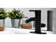Modern bathroom faucet with stylish design, complemented by elegant decor and a clean, contemporary aesthetic at 6165 Carrier Dr # 3701, Orlando, FL 32819