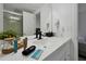 Bathroom vanity with sleek fixtures, cosmetic amenities, and a modern design for a refreshing experience at 6165 Carrier Dr # 3701, Orlando, FL 32819