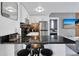 Updated kitchen with black countertops, stainless steel appliances, and bar seating at 6165 Carrier Dr # 3701, Orlando, FL 32819