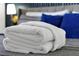 Luxurious, folded white towels add a touch of elegance and comfort to the bedroom setting at 6165 Carrier Dr # 3701, Orlando, FL 32819
