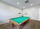 Well-lit game room featuring a classic billiards table, neutral walls and flooring at 619 Lake Marion Golf Resort, Kissimmee, FL 34759