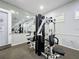 Community gym with weight-lifting equipment and mirrored wall, ideal for strength training and exercise at 619 Lake Marion Golf Resort, Kissimmee, FL 34759