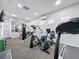 Community fitness center equipped with modern workout equipment, mirrors and ample space at 619 Lake Marion Golf Resort, Kissimmee, FL 34759