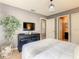 Main bedroom showcasing gray walls, an accent tree, and ensuite access at 619 Lake Marion Golf Resort, Kissimmee, FL 34759