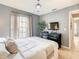 Comfortable main bedroom with gray walls, a large window and neutral accents at 619 Lake Marion Golf Resort, Kissimmee, FL 34759