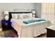Stylish main bedroom with a large bed, plush bedding, and contemporary decor at 619 Lake Marion Golf Resort, Kissimmee, FL 34759