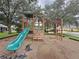 Community playground featuring a slide, stairs, and monkey bars for outdoor fun and recreation at 619 Lake Marion Golf Resort, Kissimmee, FL 34759