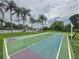 Enjoy a game of shuffleboard at the community court, surrounded by palm trees and lush greenery at 619 Lake Marion Golf Resort, Kissimmee, FL 34759