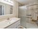 Modern bathroom featuring a walk-in shower with grab bars, a built-in bench, and a vanity at 640 Cranes Way # 164, Altamonte Springs, FL 32701