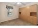 Comfortable bedroom with carpet flooring, a large built-in wardrobe, and natural light at 640 Cranes Way # 164, Altamonte Springs, FL 32701