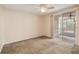 Cozy bedroom with carpet flooring, a ceiling fan, and sliding glass doors leading to an outdoor space at 640 Cranes Way # 164, Altamonte Springs, FL 32701
