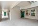Condo exterior with a green front door and neutral-colored siding, offering a welcoming entrance at 640 Cranes Way # 164, Altamonte Springs, FL 32701