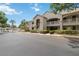 Inviting condo complex with well-manicured grounds, easy parking, and a glimpse of a community pool at 640 Cranes Way # 164, Altamonte Springs, FL 32701