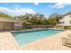 A community swimming pool with lounge chairs sits near the clubhouse on a sunny day at 640 Cranes Way # 164, Altamonte Springs, FL 32701